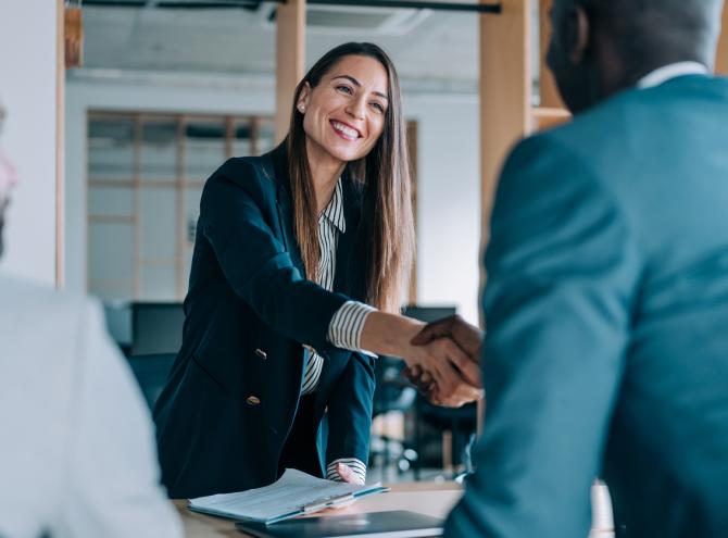 Business people shaking hands in the office.