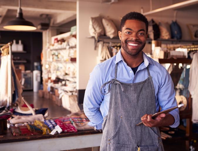 Owner of gift store with tablet 