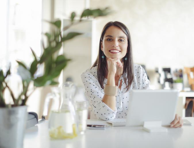 Young woman working in her office